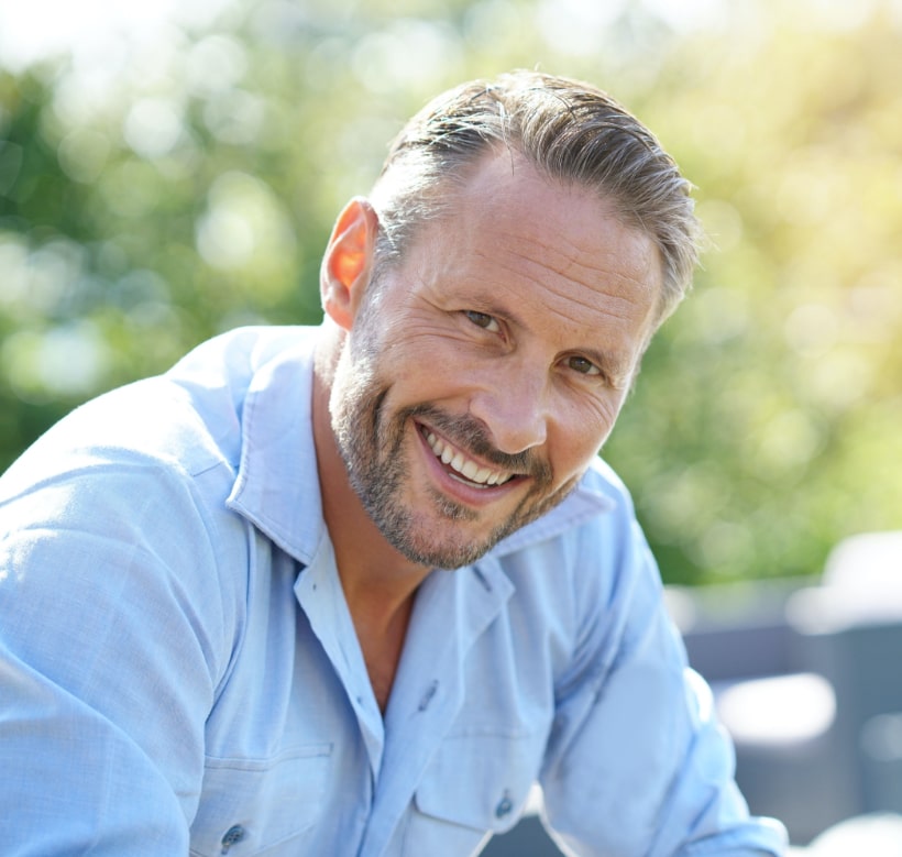 TMJTreatment1 mature man showing off his smile