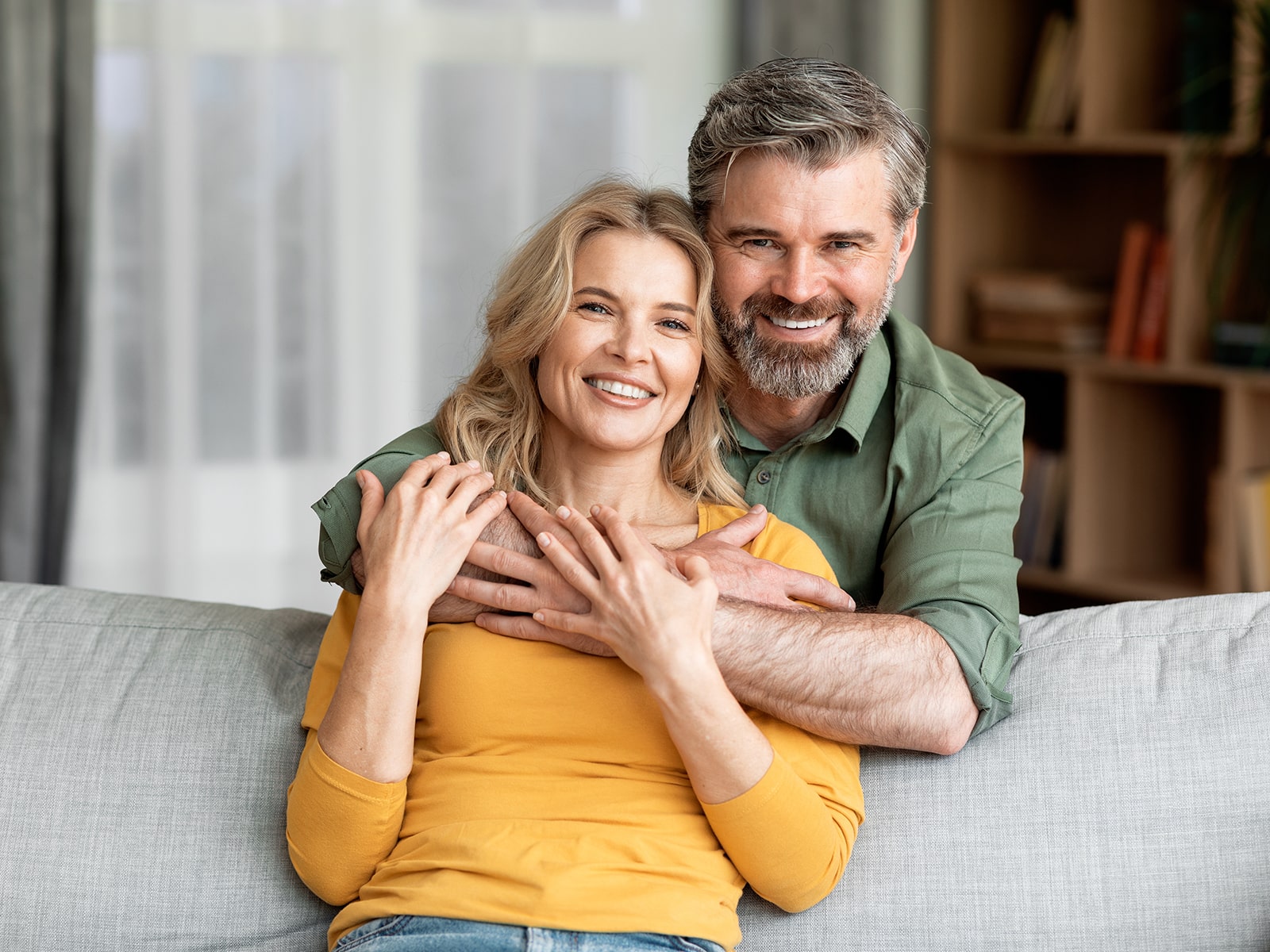 Couple smiling on couch