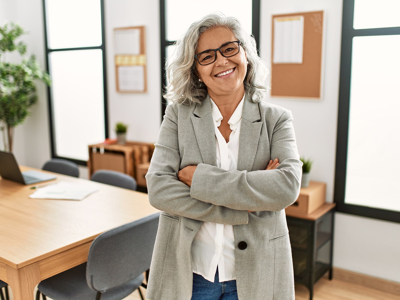 Mature woman smiling in office