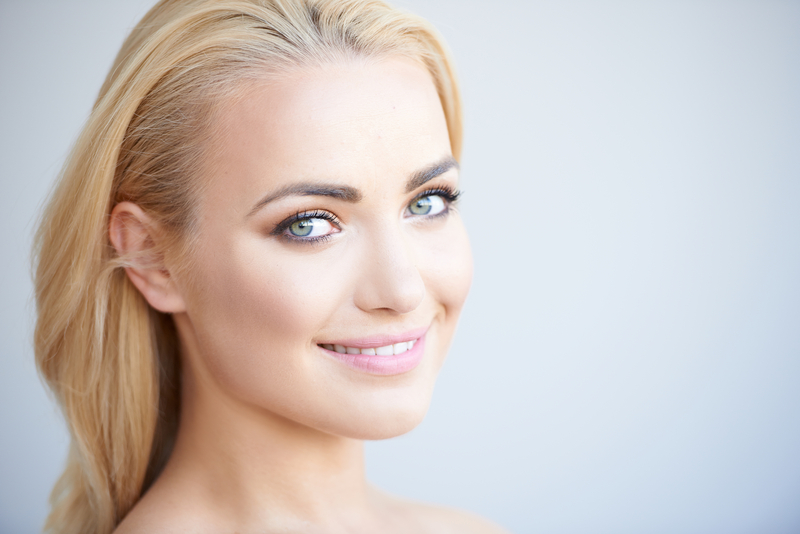 attractive young woman shows off his amazing smile